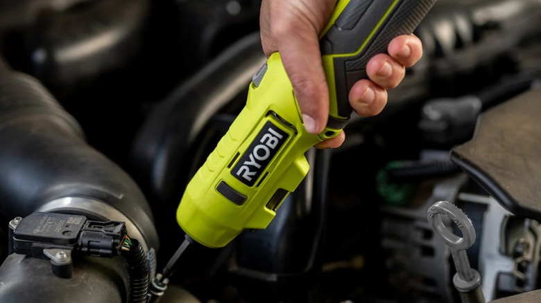 USB Lithium Screwdriver extended and being used on a car