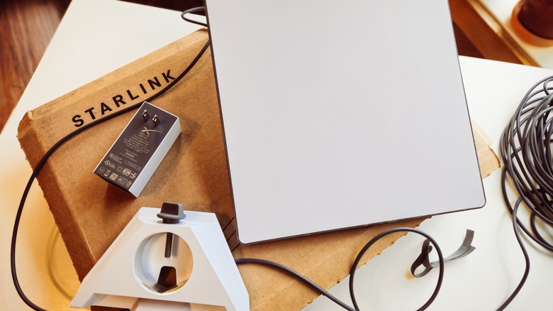 A Starlink mini kit sitting on its cardboard box