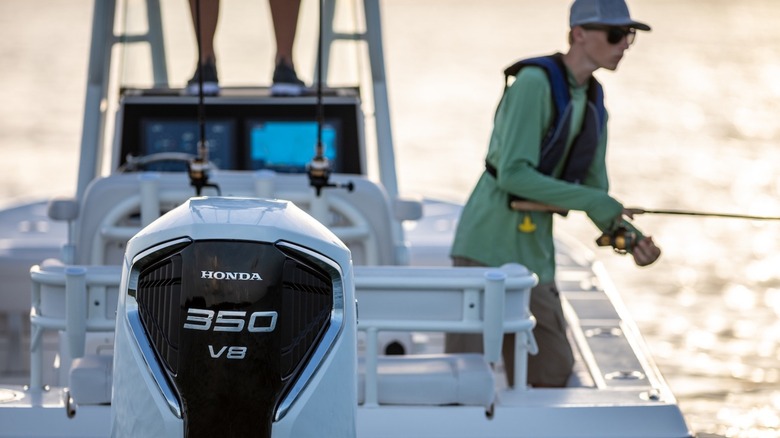 Honda BF350 outboard motor on a boat with man fishing