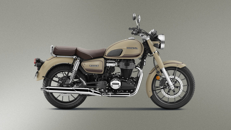 Side view of a Honda CB350C Special Edition in mat dune brown with a cream background