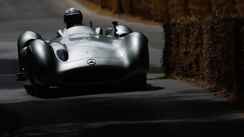 Mercedes W196 Streamliner competing on-track at Goodwood, front-view