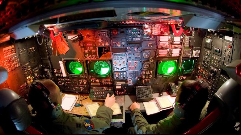 Two pilots sit at control on a B-52
