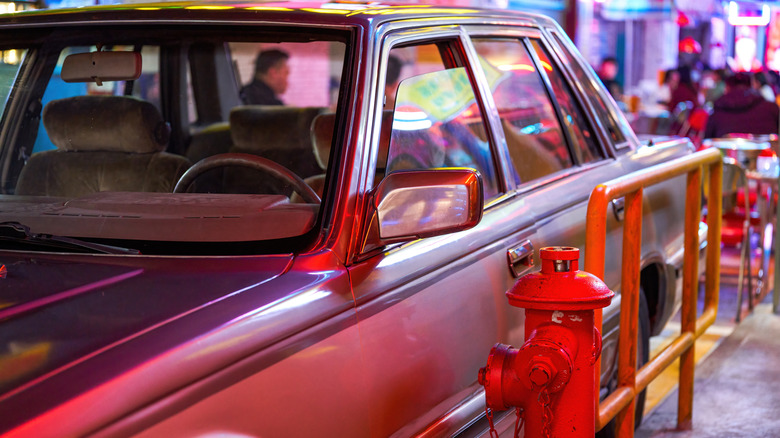 Car parked in front of a fire hydrant