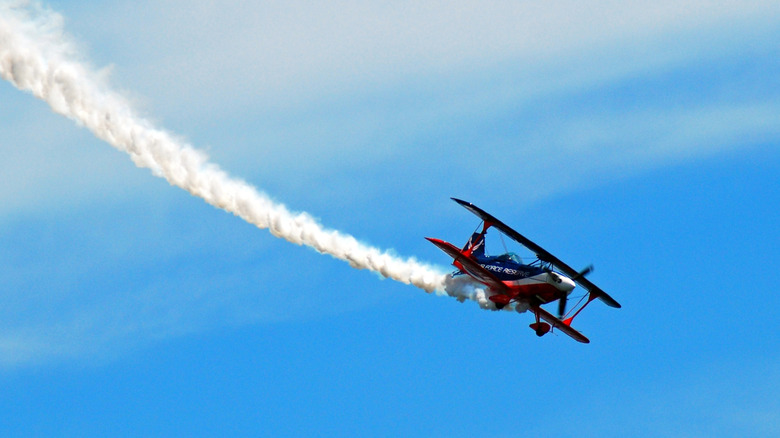 A biplane flying and skywriting