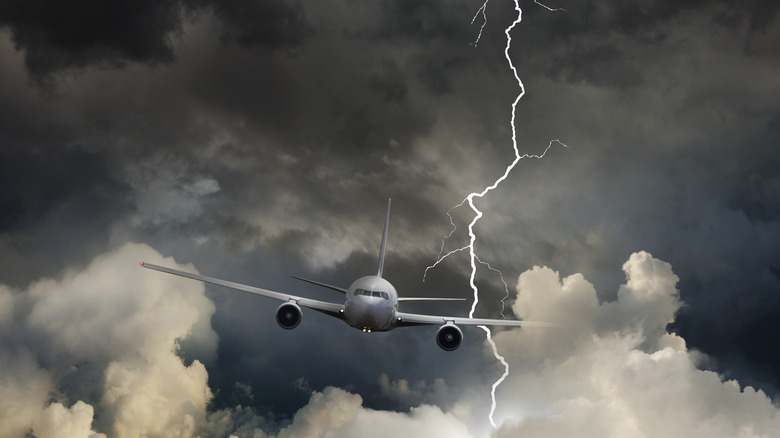 Image of an airplane flying in a thunderstorm.