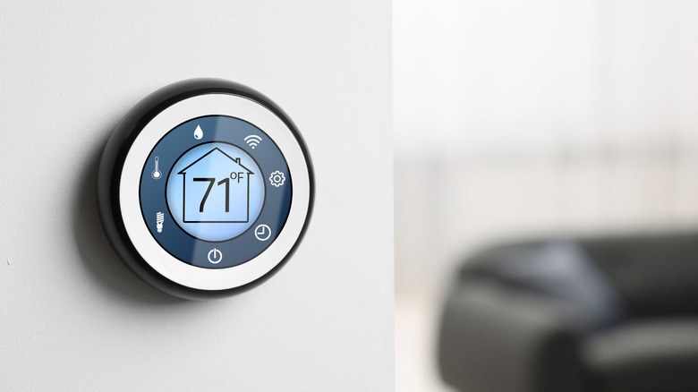 Smart thermostat on wall in room