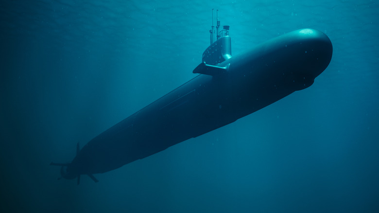 Military submarine cruising under the ocean