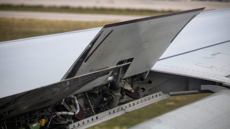 Wing spoilers deploying on a jet