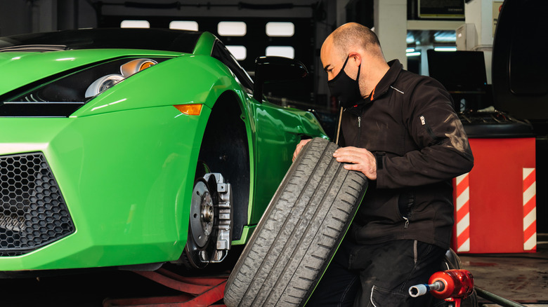 Mechanic repairs Lamborghini Gallardo