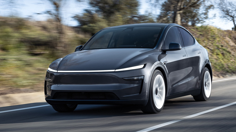 Gray Tesla Model Y driving on road