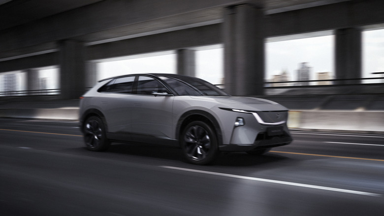 Front 3/4 view of Mazda EZ-60 on the move, silver exterior