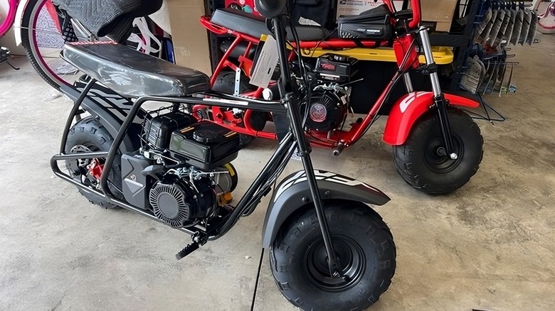 Two FRP mini bikes in a garage