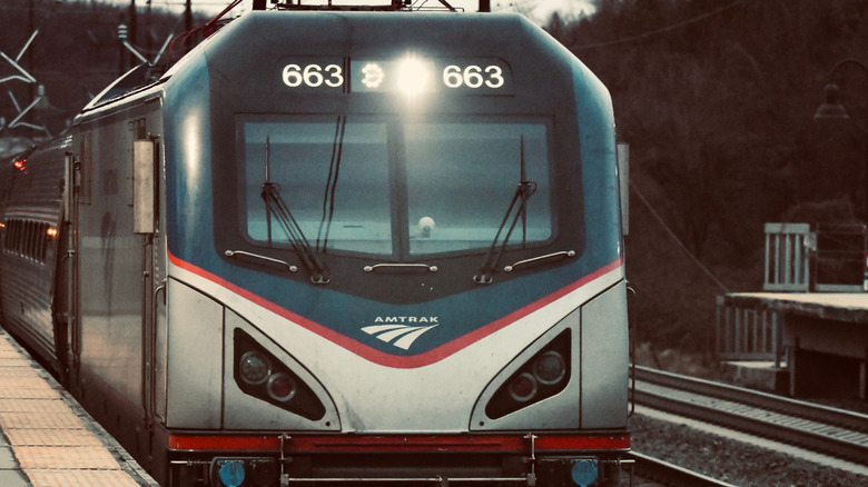 Head on view of Amtrak train arriving in station