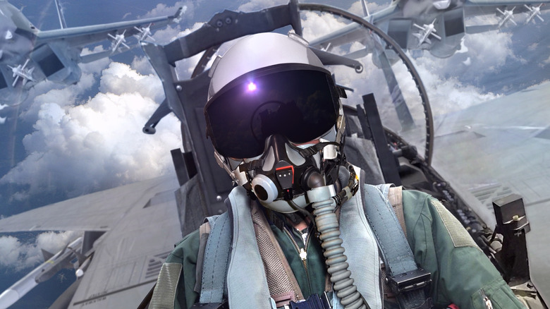 Jet fighter pilot in cockpit view with wingman support