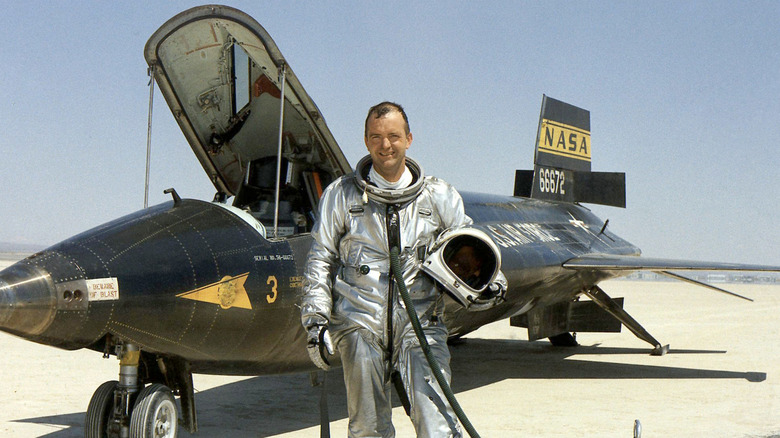 NASA research pilot Bill Dana standing next to the the North American X-15
