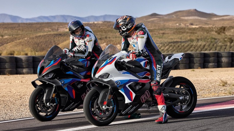 Riders of BMW's M1000RR sit in wait at the starting line