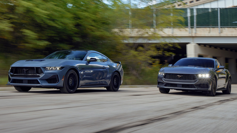 Seventh-gen Ford Mustang EcoBoost and GT models driving down a road