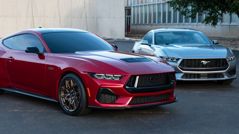 Seventh-gen Ford Mustang GT and EcoBoost models parked on a paved surface