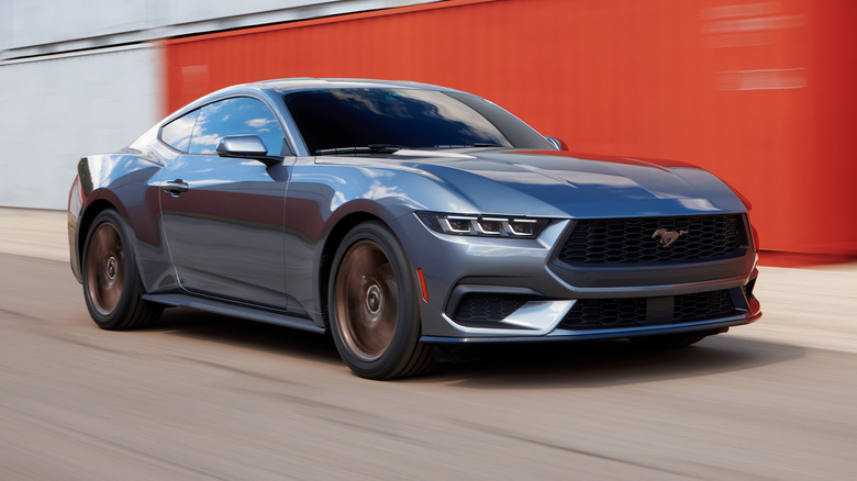Silver seventh-generation Ford Mustang in motion