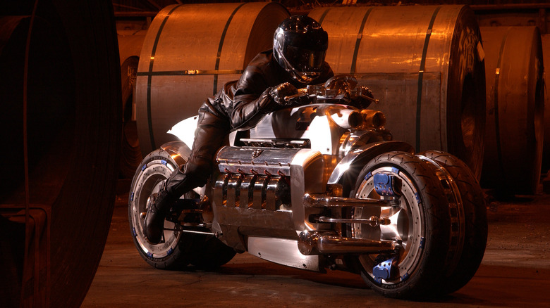 A rider sits astride the Dodge Tomahawk motorcycle