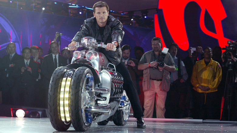 Wolfgang Bernhard, COO of Chrysler Group, rides the Tomahawk onto the stage
