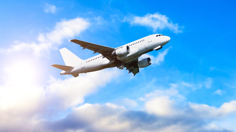 An airplane flying among the clouds.