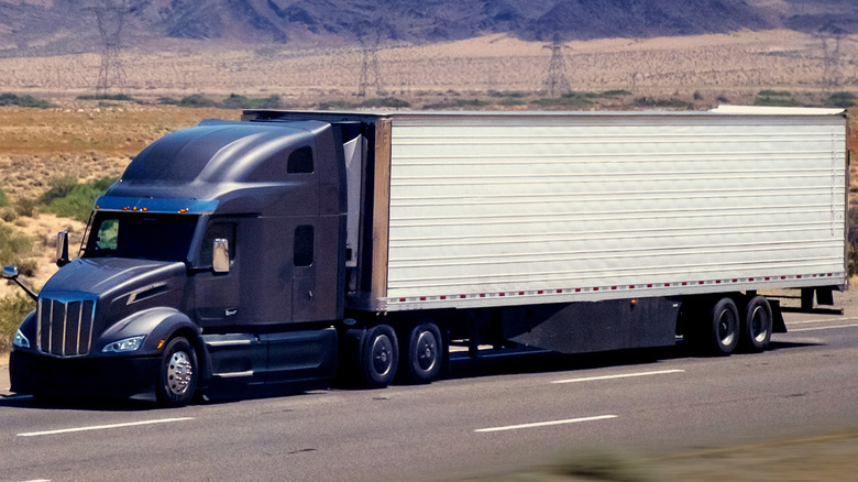 A semi-trailer truck on the highway