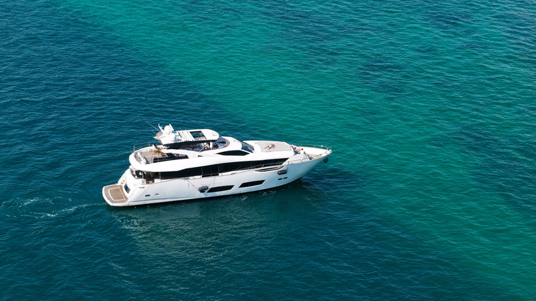 Motor yacht in clear calm sea