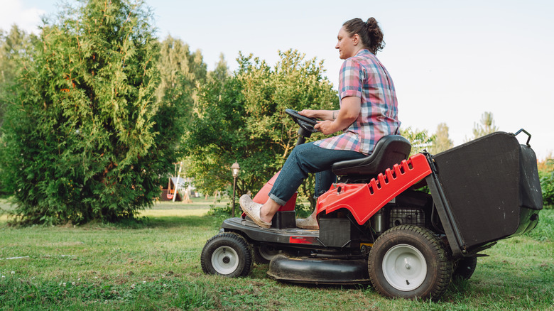 Picture of a woman using a tractor mower