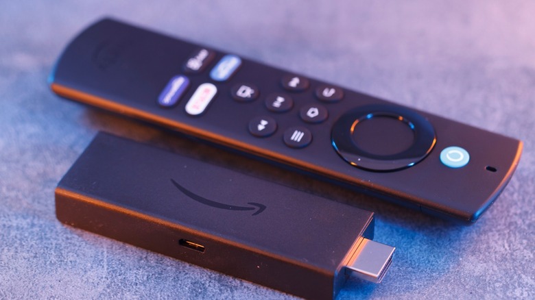 Fire TV Stick next to its remote