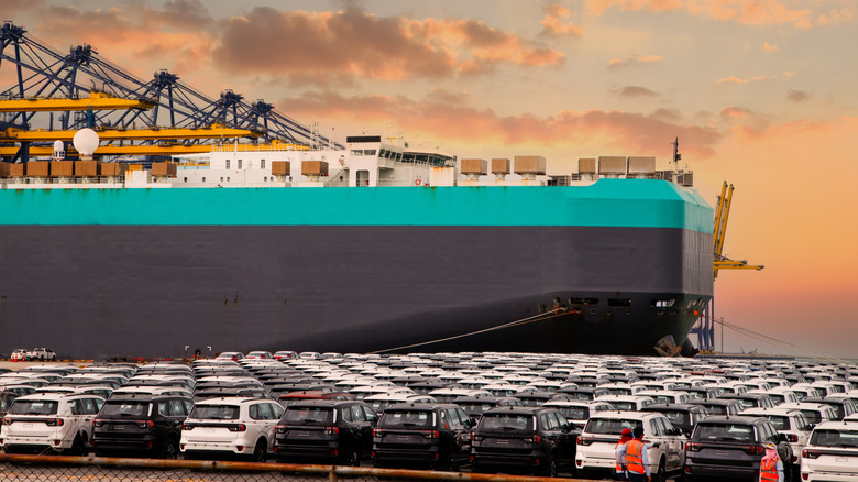 Hundreds of cars awaiting transport on a large car carrier vessel