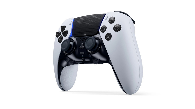 A black and white DualSense Edge wireless controller at a 3/4 angle.
