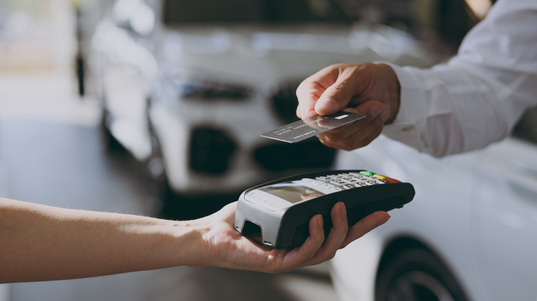 Card transaction in a car showroom