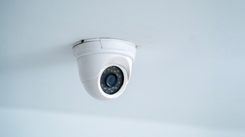 IP CCTV camera on white background with home security system concept.