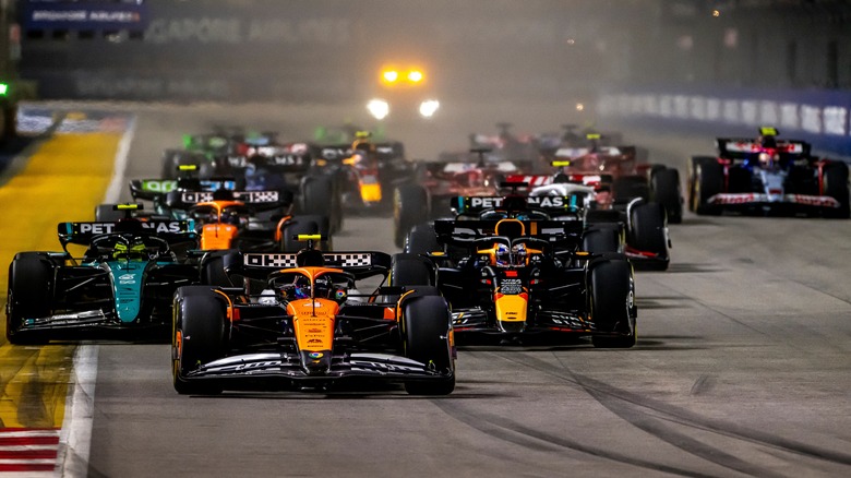 F1 cars bunched up at the start of a race