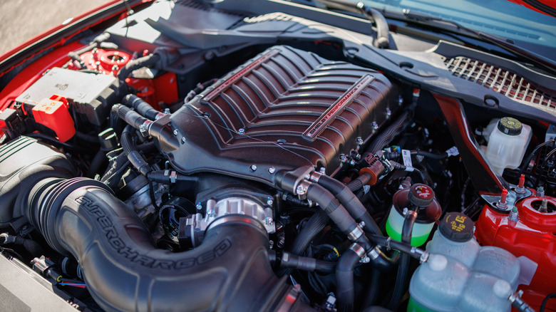 A supercharged Shelby American engine in an engine bay
