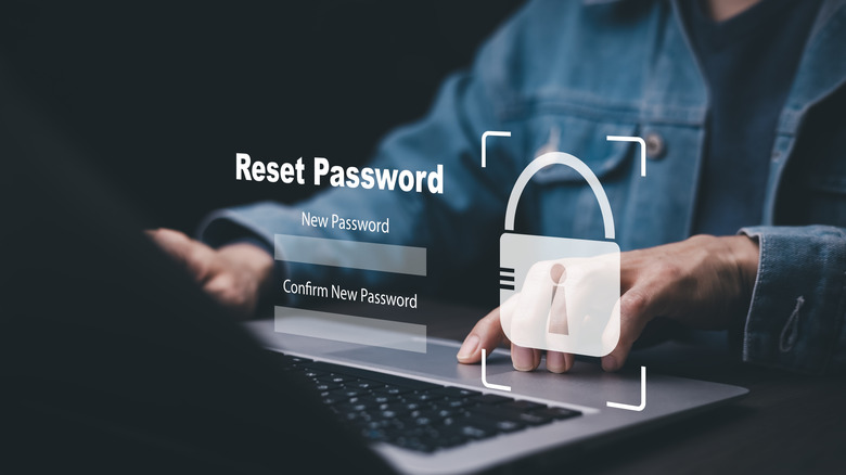 A person using a laptop and resetting their password