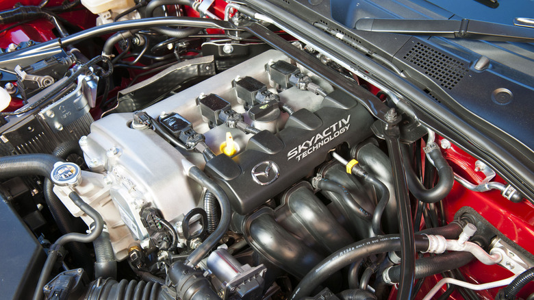 A close-up of a Mazda MX-5 Miata SKYACTIV engine.