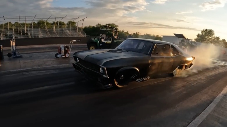 187 Customs Proline Hemi-powered "Murder" Chevrolet Nova performing burnout on drag strip