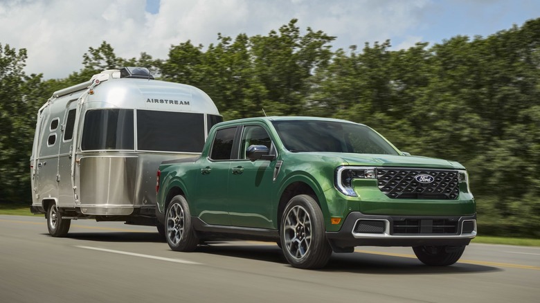 Green 2025 Ford Maverick towing an Airstream trailer