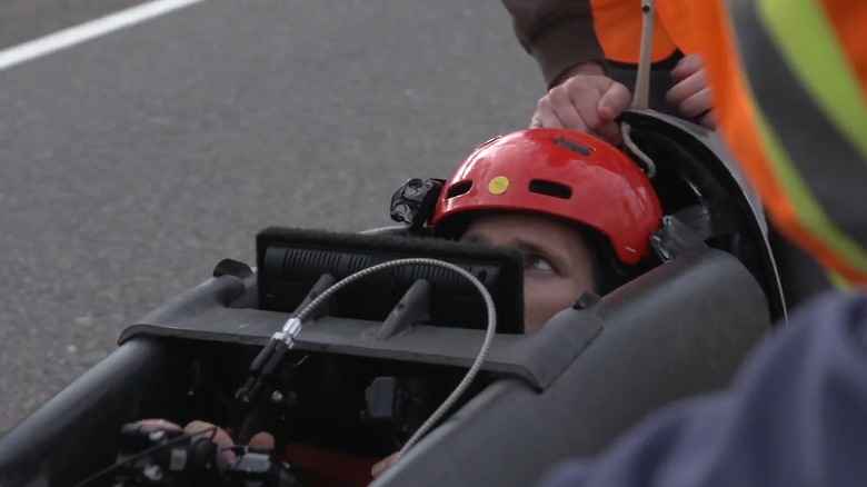 Todd Reichert on the Eta speedbike without the shell showing a display screen mounted in front