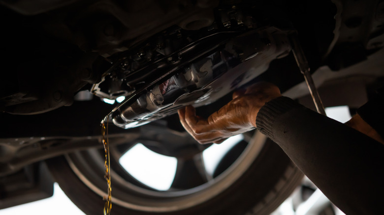 Mechanic draining old ATF