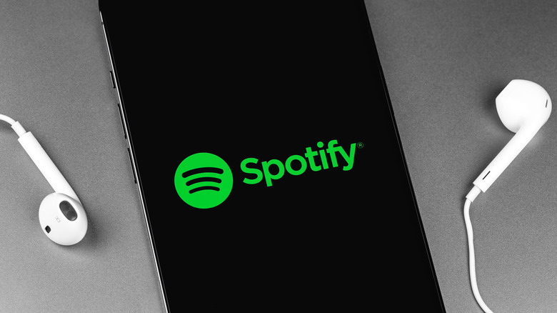 phone with spotify logo and headphones
