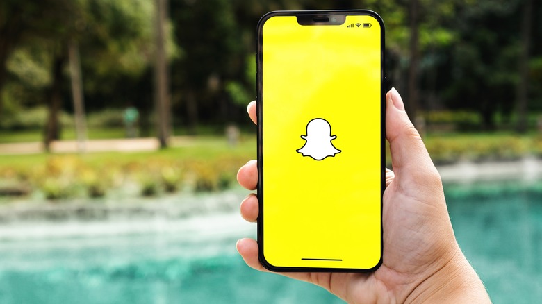 woman using snapchat outdoors