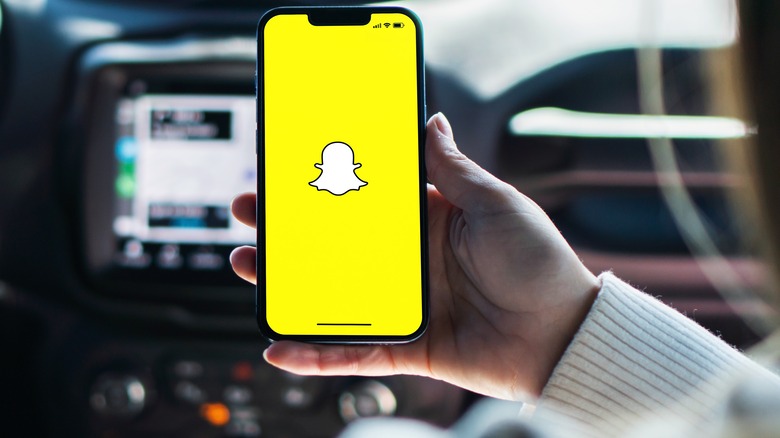 woman using snapchat in car