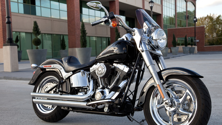 Harley Fat Boy is parked outside an office complex