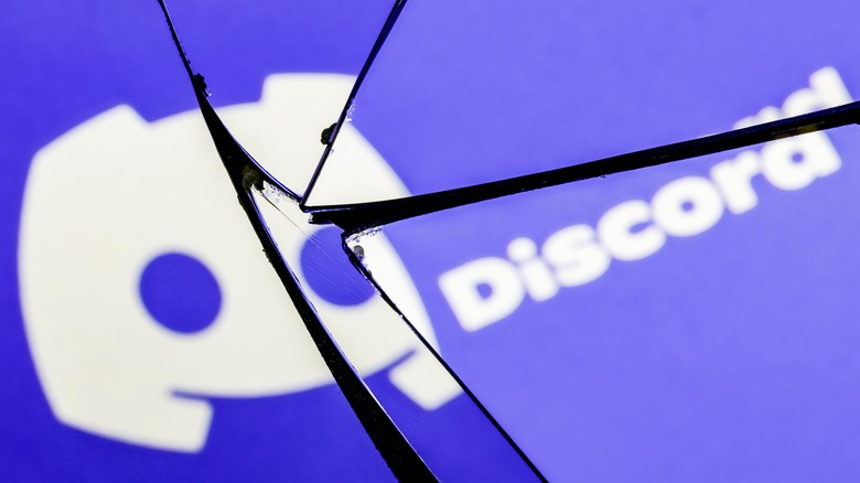 Discord logo reflected in broken mirror