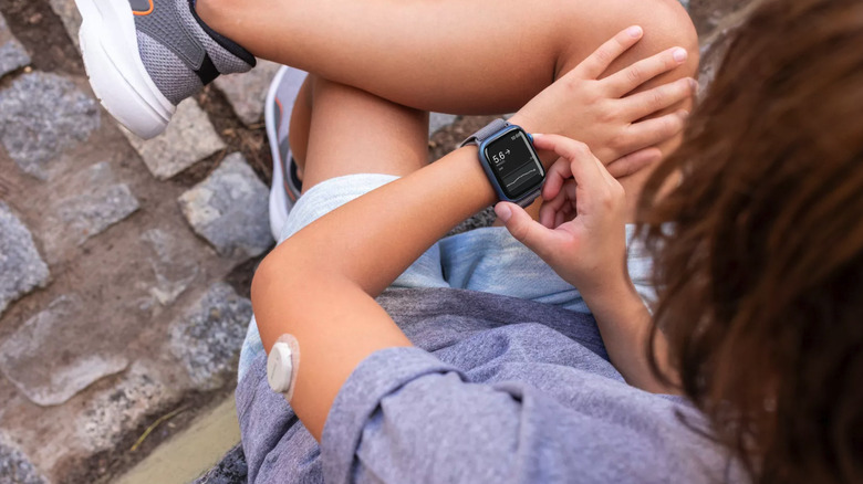 Woman with Dexcom G7 wearing an Apple Watch