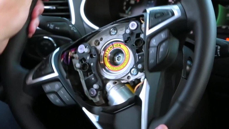 View inside the steering wheel of a Ford. Observing the Adaptive Steering system
