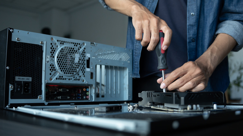 Man working on PC components